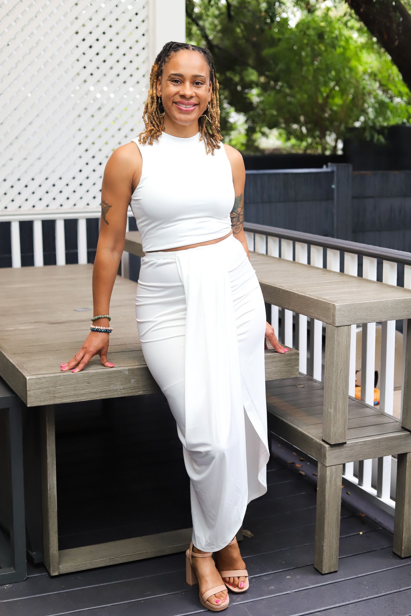 Siobhan J. Middleton in a white outfit outdoors